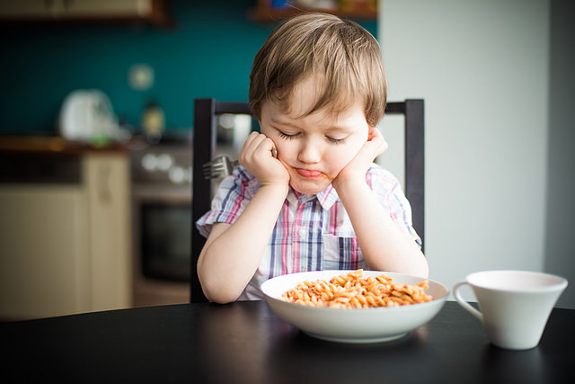 Child eating gluten free pasta